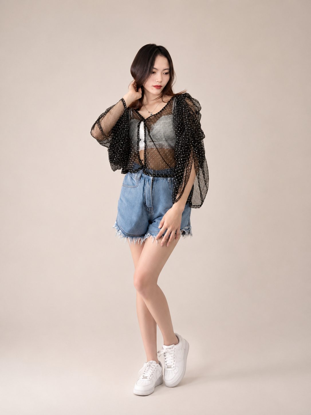 Model wearing PYONTSÜ sheer mesh top
